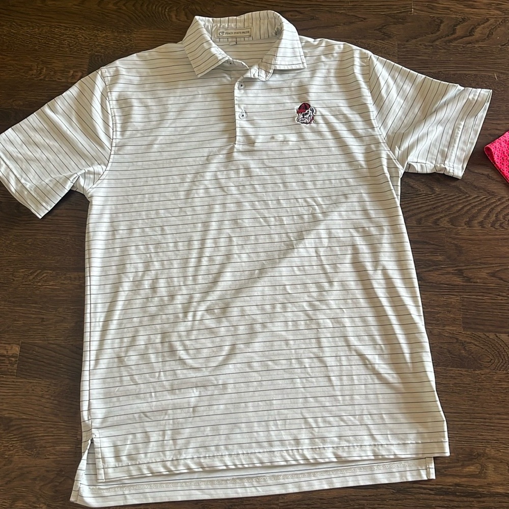 Size small peach state pride UGA golf polo has one stain in picture